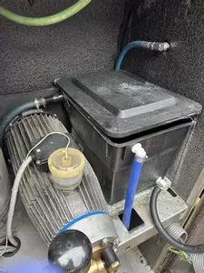 Original inlet water tank setup on a Nilfisk SH Truck prior to modification. The existing configuration was prone to inconsistent supply and required upgrading to improve flow stability and overall machine reliability.